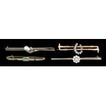 A 15ct white and yellow gold mounted diamond bar brooch set with nine small brilliant cut diamonds