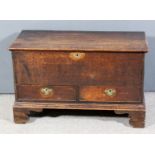 An 18th Century plain oak mule chest, with plain lid, now fitted one real and one dummy drawer, on