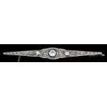 A 20th Century 18ct white gold mounted three stone diamond bar brooch, the centre stone