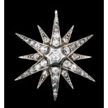 A Victorian, gold coloured metal mounted and all diamond set twelve pointed star pendant, set with