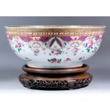 A Chinese "Famille Rose" porcelain punch bowl, the whole enamelled in colours with floral sprays,
