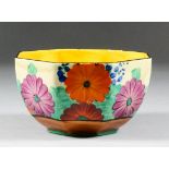 A Clarice Cliff "Fantasque" pottery octagonal bowl painted with "Gayday" pattern, 5.125ins