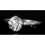 A silvery coloured metal mounted solitaire diamond ring set with brilliant cut stone (