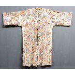 A 20th Century Chinese silk embroidered robe worked with figures in a landscape on an ivory silk