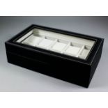 Four faux leather wristwatch display boxes