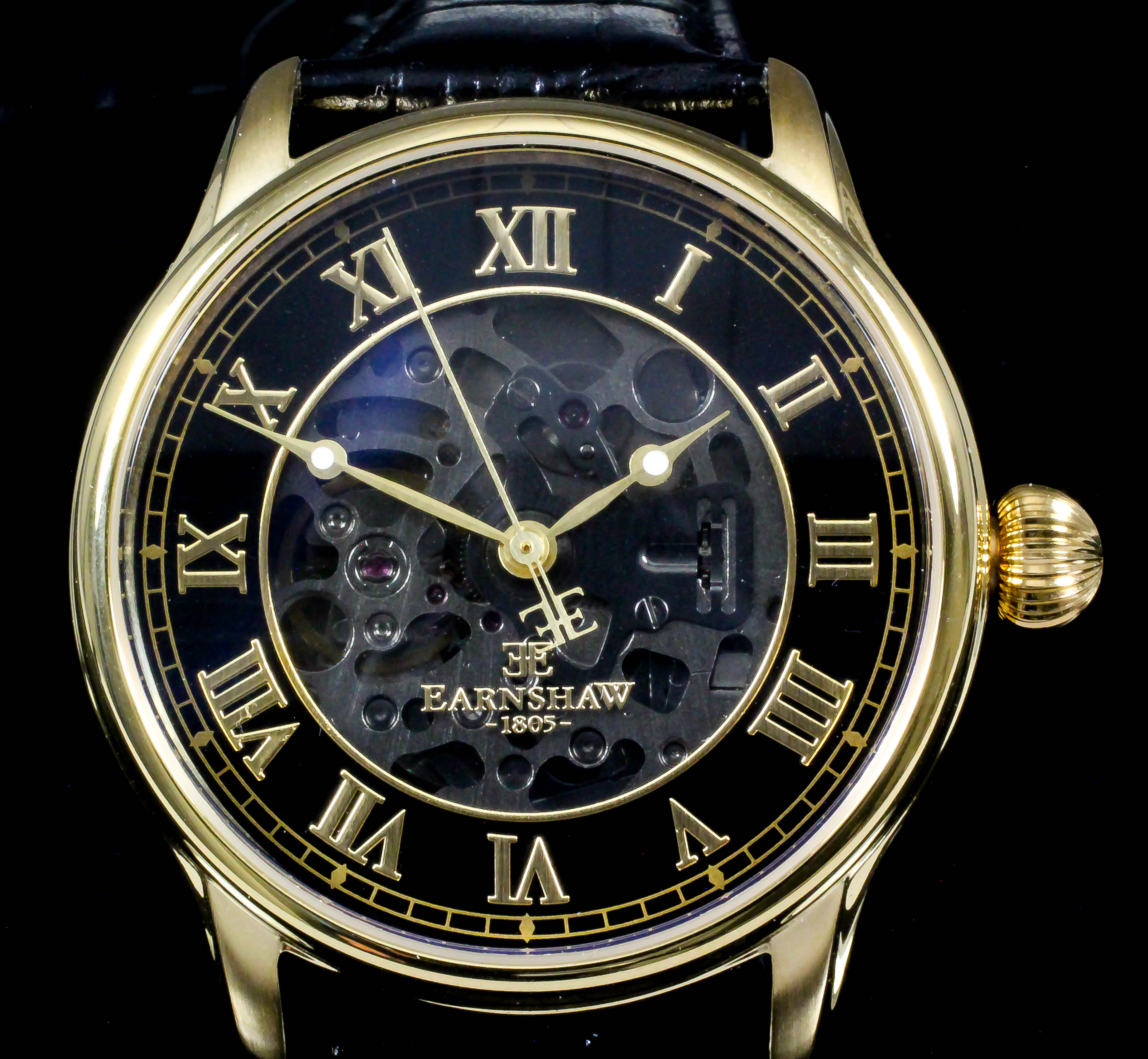 A gentleman's automatic wristwatch by Thomas Earnshaw, with black bezel with gilt Roman numerals,