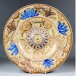 A late 19th Century "Hispano Moresque" circular charger of 16th Century design with raised central