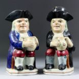 A late 19th/early 20th Century pottery Toby jug of traditional form, 2.5ins high, and another,
