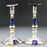 A matched pair of English 18th Century enamel tapersticks, each enamelled and gilt with scattered