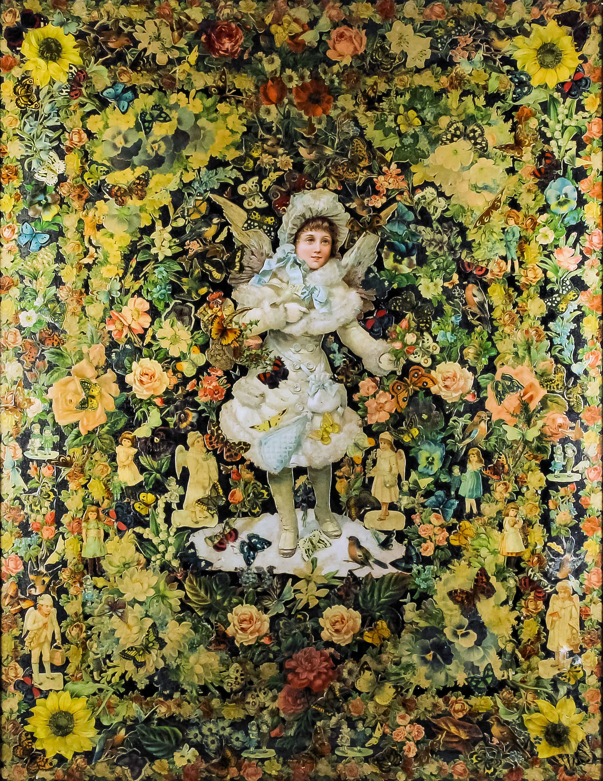 A late Victorian printed and coloured collage of a young winged putto with fur trimmed white coat