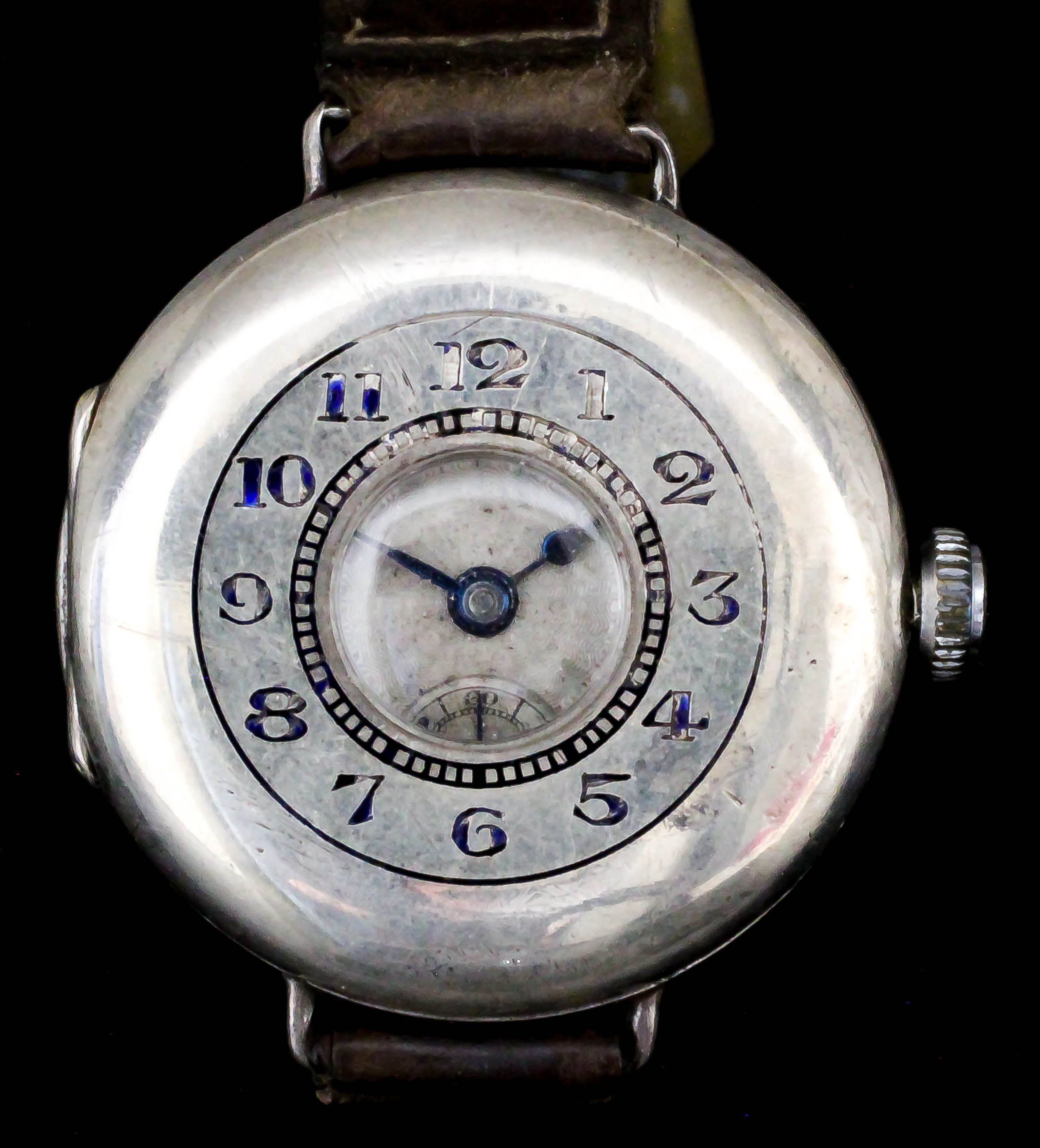 An early 20th Century lady's silvery metal cased half hunting wristwatch by Vertex, the silver