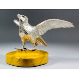 A Japanese silvered bronze okimono in the form of an eagle with outstretched wings, 5.25ins (13.5cm)