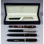 An Aspinal of London black leather and silver rollerball pen, in original case, together with four