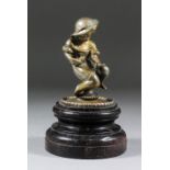 A French cast metal car mascot modelled as a child sculptor, on a turned hardwood base, 7ins high