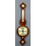 A Victorian mahogany wheel cased barometer, thermometer and hydrometer by Winder of Canterbury with