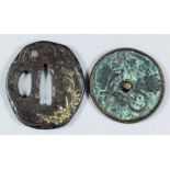 A Japanese iron and shakudo Tsuba decorated with various grasses and a silver moon, the reverse with