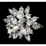 A modern 18ct white gold mounted diamond cluster ring of floral design set with brilliant cut