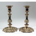 Two silver gilt pillar candlesticks of "early 18th Century" French design, with square moulded