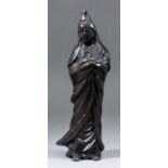 A Chinese brown patinated bronze standing figure of Guan Yin, 10.25ins (260mm) high (17th/18th