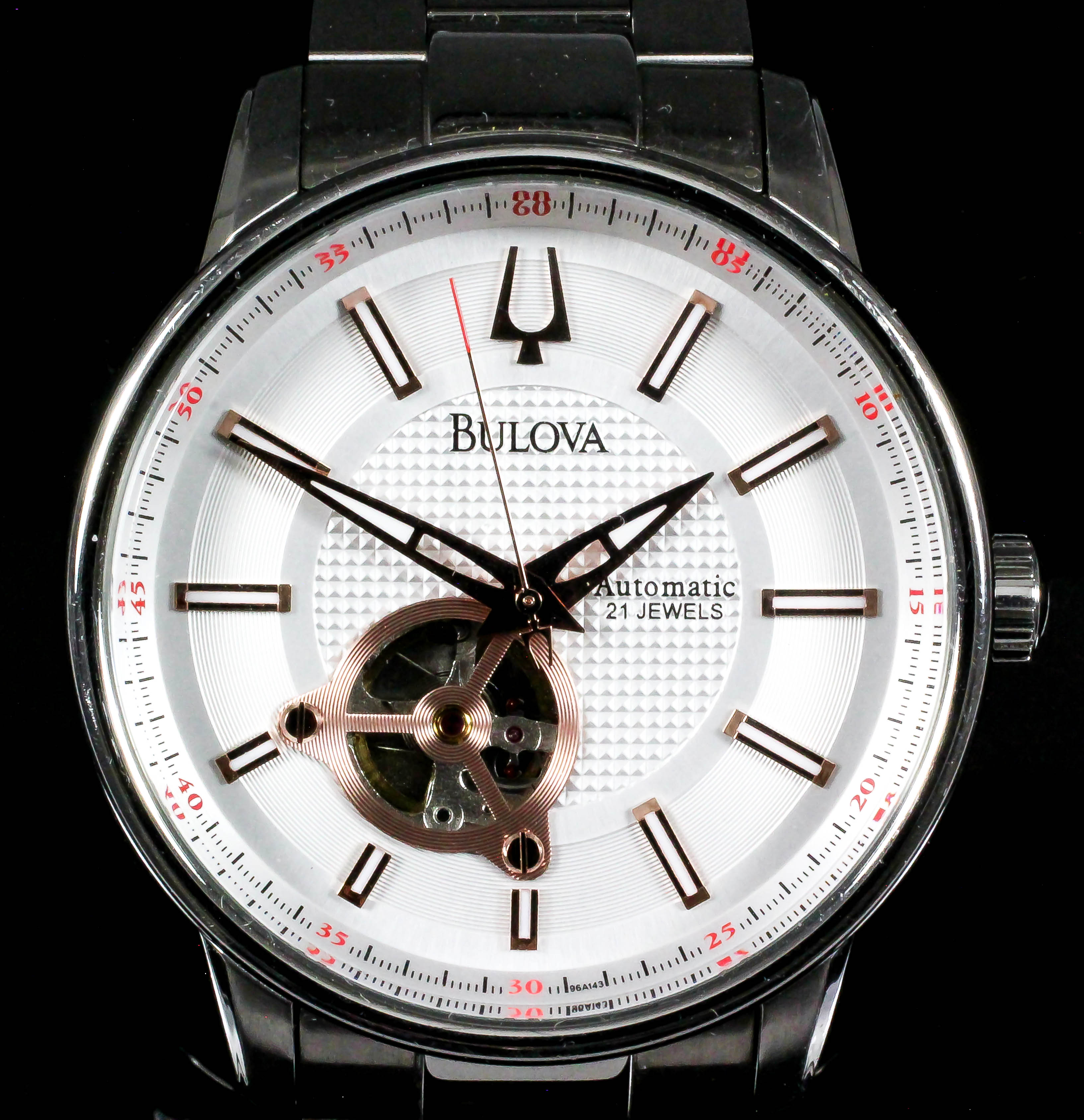 A gentleman's automatic wristwatch by Bulova, the white dial with exposed balance cock, stainless