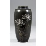 A Japanese bronze vase of baluster form moulded with two flowering chrysanthemum stems with