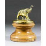 A car mascot modelled as an elephant, on a turned wood base, 5.5ins high