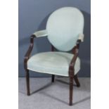 A George III mahogany oval back armchair of "Hepplewhite" design, the seat, back and armpads