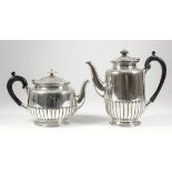 A late Victorian silver cylindrical teapot and coffee pot with slightly domed covers, part reeded