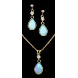 A 9ct gold mounted opal and diamond tear drop pendant and pair of matching earrings (for pierced