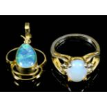 A gold coloured metal mounted opal pendant, set with tear drop opal (approximately 2.5ct) in