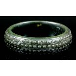 A 20th Century spinach jade bangle with scroll carved face (weight 143 grammes)