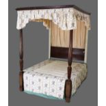 An oak and mahogany 4ft 6ins four poster bedstead comprising oak moulded cornice and two George