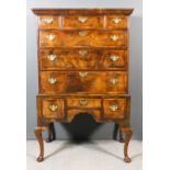 An 18th Century walnut and pine sided chest on stand, the upper part with moulded cornice, fitted