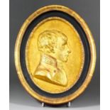 A 19th Century French plaster oval portrait plaque of Napoleon as First Consul, shown in profile, in