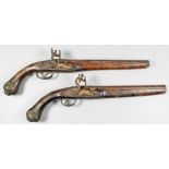 Two 19th Century .75 calibre flintlock pistols in the Ottoman style, one 12ins plain steel barrel,