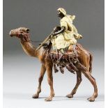 Franz Bergmann (1898-1936) - Cold painted bronze - An Arab holding a rifle and seated on a camel,