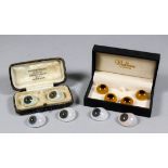 Six early 20th Century glass eyes, contained in a case bearing the name Godfrey G Taylor, Ocularist,