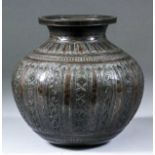 An Indian bronze bulbous vase, the body with alternating panels engraved with lozenge and scroll