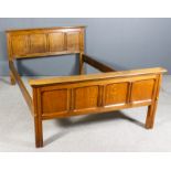 A late 1920's panelled oak 5ft bedstead designed by Gordon Russell (and made in The Russell
