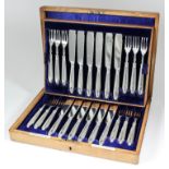 A set of twelve late Victorian silver fish knives and twelve fish forks with shaped blades and