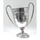 A Victorian silver two-handled cup with reeded rim and girdle, beaded and leaf moulded high scroll