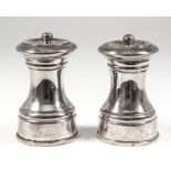 A pair of late Victorian silver salt and pepper mills, 4ins high, by J. P., London 1890,