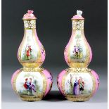 A pair of late 19th Century Helena Wolfsohn porcelain double-gourd vases and covers, enamelled in