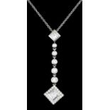 A modern 18ct white gold mounted diamond drop pendant by Tiffany & Co, collet set with five