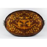 An Edwardian mahogany two-handled oval tray, inlaid with winged putti holding goblets, within a vine