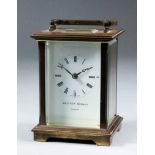 A modern carriage clock by Matthew Norman of London, No. 1754, the white enamel dial with Roman