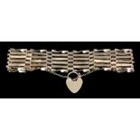 A 9ct gold six bar gate bracelet with heart pattern padlock clasp (weight 12.5 grammes)