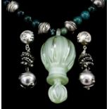 A modern silver and green agate bead necklace hung with a green glass pendant in the form of an