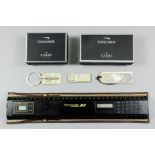 A Concorde souvenir rule with integral calculator and quartz clock, contained in a Concorde