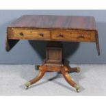 A George IV rosewood and brass inlaid sofa table, the whole inlaid with stringings, fitted two